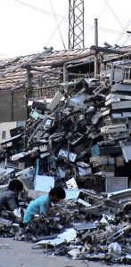 Image of children digging through an electronics waste dump