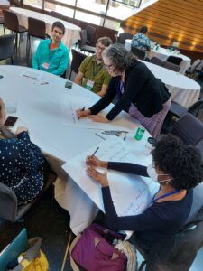 Forum attendees participate in a table discussion